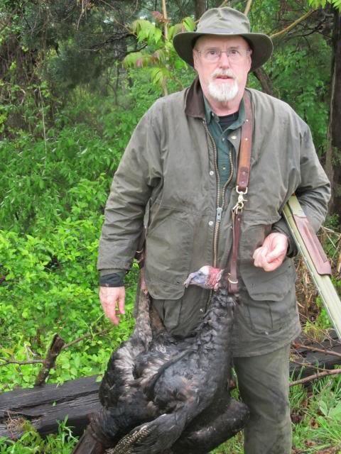 Earl Sechrist carrying a Virginia wild turkey