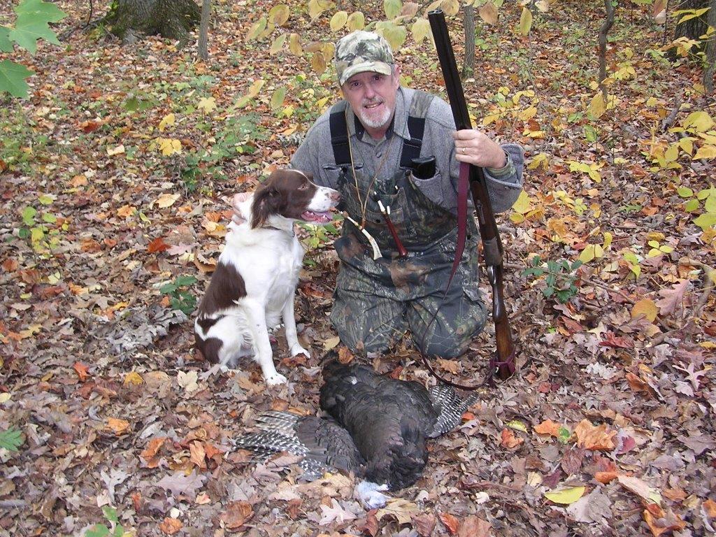 old Virginia turkey hunter and his dog with a wingbone call