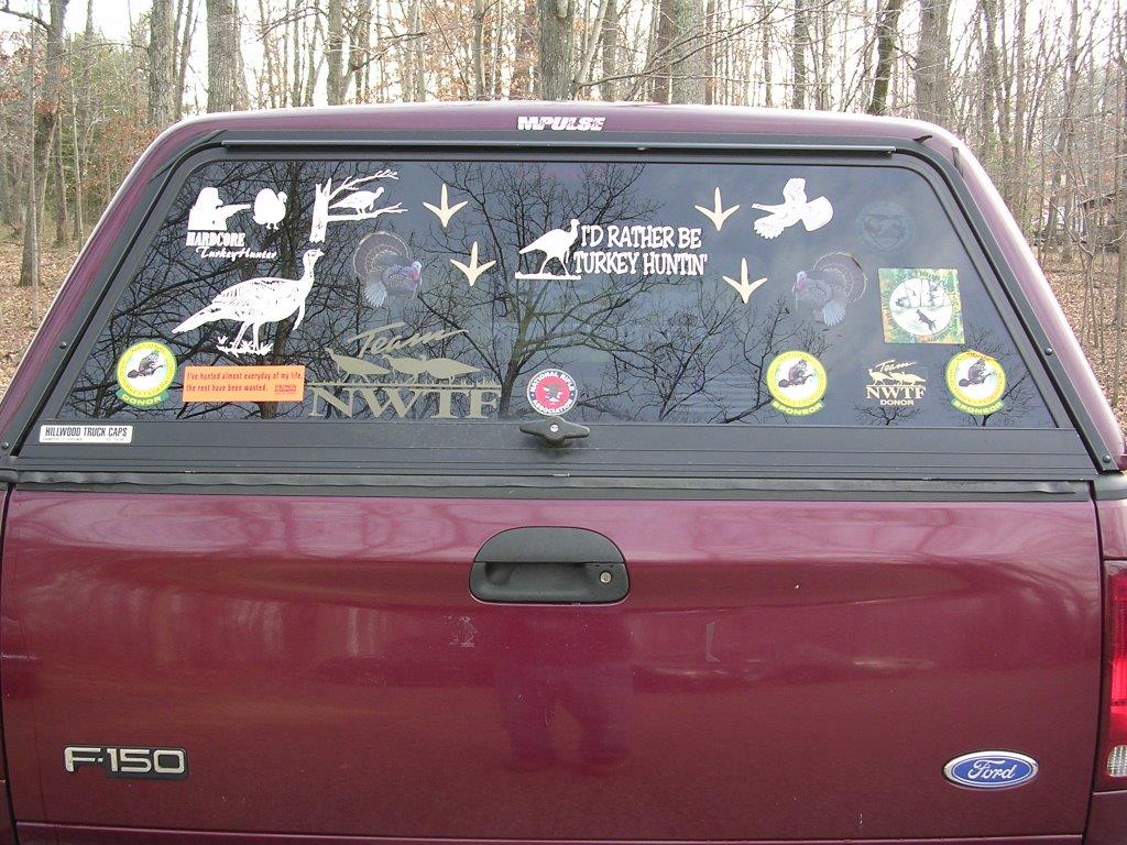 a few decals on the back of a truck